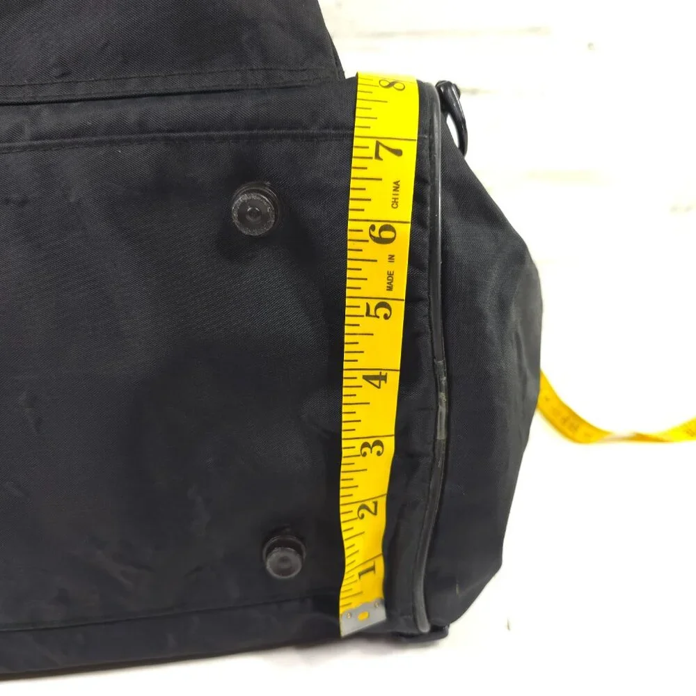 VINTAGE HARLEY DAVIDSON AN AMERICAN LEGEND BLACK DUFFLE BAG WITH SHOULDER STRAP.